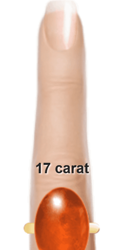 Orangey Red 17 carat cabochon-cut Sunstone on a ring and finger.