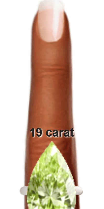 Light Yellowish Green 19 carat pear-cut Diaspore on a ring and finger.