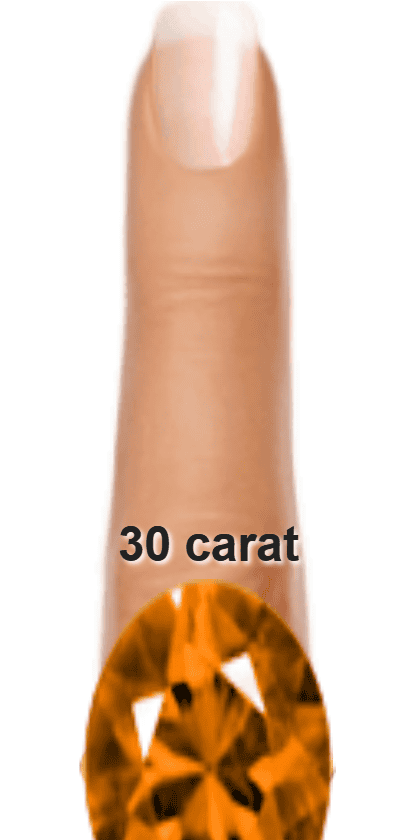 Orange 30 carat oval-cut Andesine on a ring and finger.
