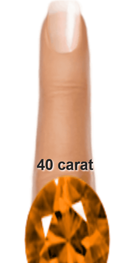 Orange 40 carat oval-cut Andesine on a ring and finger.