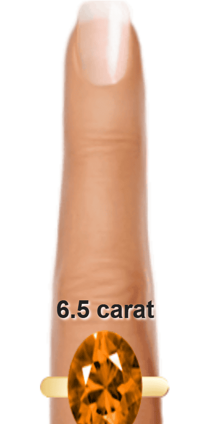 Orange 6.5 carat oval-cut Andesine on a ring and finger.